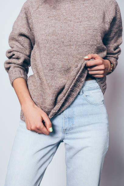 istock Young female wearing trendy oversized brown sweater 1125149348