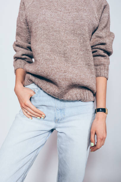 istock Young woman wearing plain oversized brown sweater 1125149351