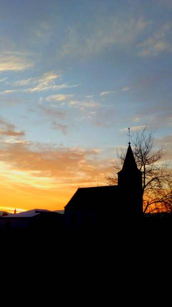 istock Sunrise behind church 1125154756