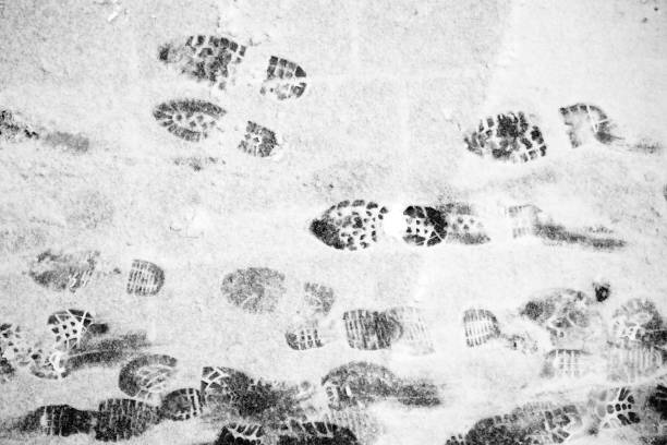 istock Shoe prints on winter snowy road 1125156012