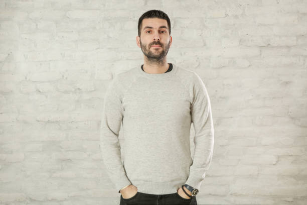 istock Portrait of handsome bearded man in a grey pullover 1125160891