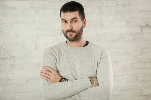 istock Portrait of handsome bearded man in a grey pullover 1125160944