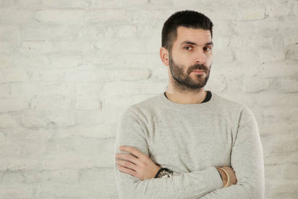 istock Portrait of handsome bearded man in a grey pullover 1125161033