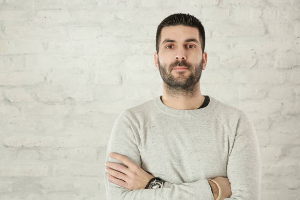 istock Portrait of handsome bearded man in a grey pullover 1125161043