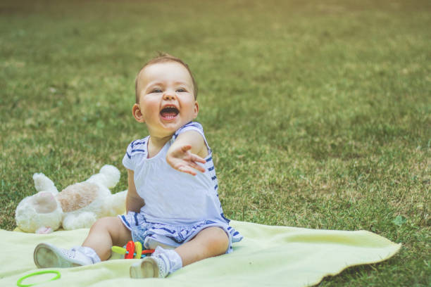 istock Baby girl is playing in park 1125174245