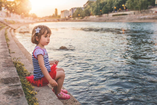 Little girl enjoy by river