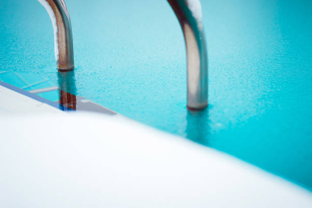 Swimming pool ladder and frozen water