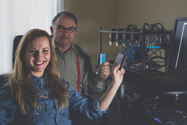 istock Woman and her father are working on cryptocurrency mining 1125176446