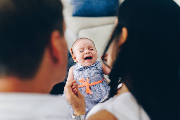 istock New baby at home with mom and dad 1125176663