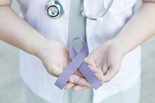 periwinkle blue ribbon awareness in doctor hand for acid reflux (gerd), eating disorders, anorexia, bulimia, esophageal, gastric, pulmonary hypertension, stomach cancer - cancro gástrico imagens e fotografias de stock