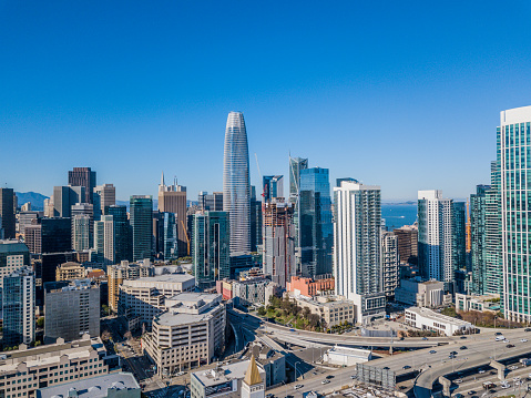 An aerial view of the skyline of San Francisco with the Salesforce Tower towering above the other skyscrapers. Clear sunny day with clear view of the business district.