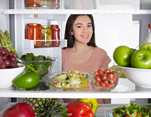 istock Woman and fridge 1125205069
