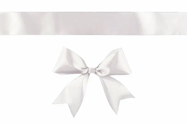 Photo of White ribbon bow isolated on white background