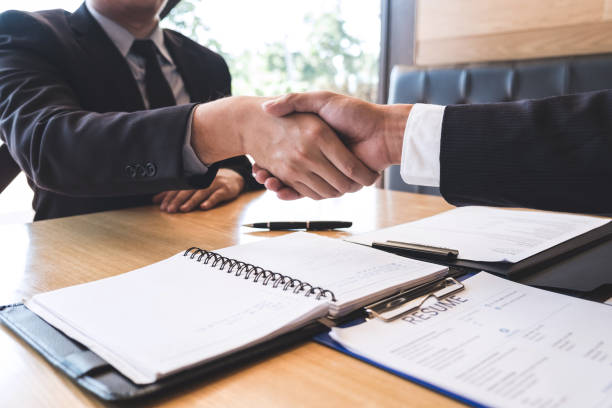 istock Successful job interview with boss and employee shaking hands after negotiation or interview, career and placement concept 1125210422