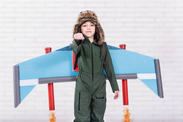 istock Child pretending to fly with jet pack 1125213692