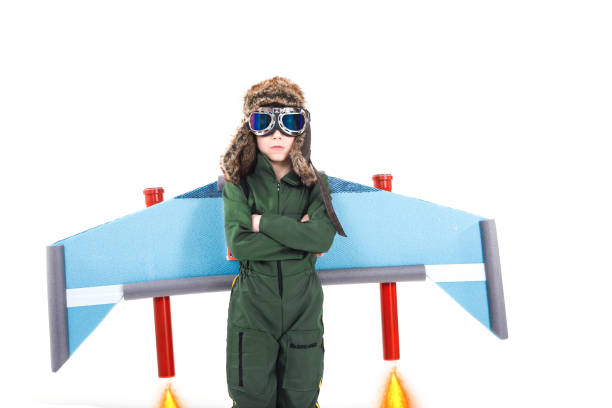 boy pretending to be pilot ready to fly - distress rocket imagens e fotografias de stock