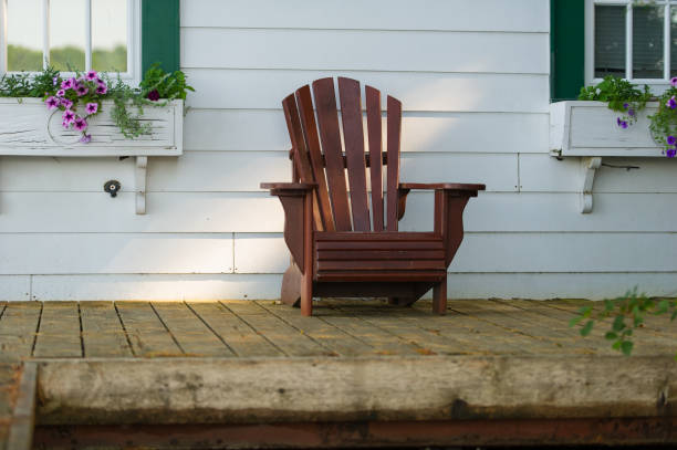 istock Adirondack chair sit on a cottage porch 1125219797