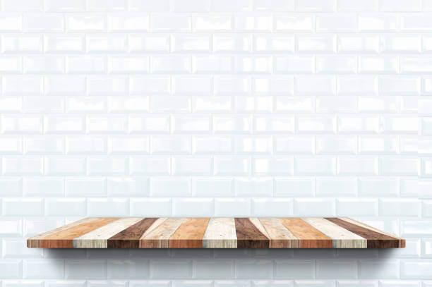 istock Empty wood bookshelf on glossy white tile wall background,Backdrop interior mock up for display or montage of product for advertising online. 1125222087