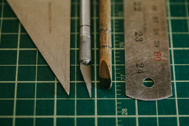 istock Artistic Printing Graphic Designer Tools Lined Up on a Cutting Matte 1125224767