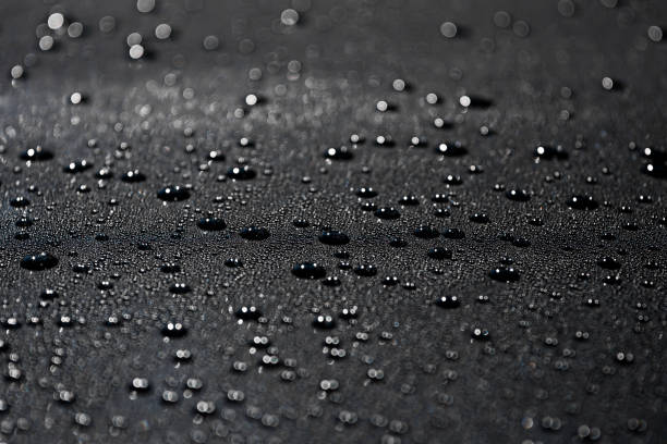 istock water drops on a black metal surface 1125238891