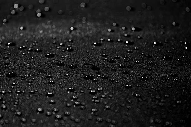 istock water drops on a black metal surface 1125238966