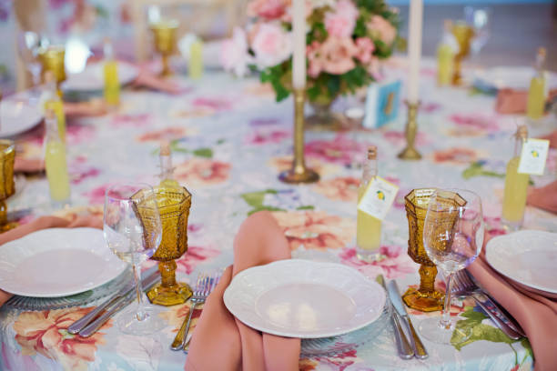 istock table setting with orange glasses and pink napkins 1125247247