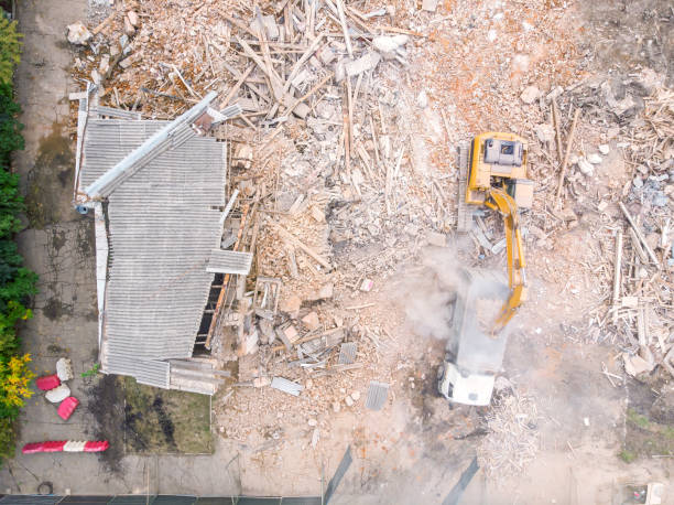 istock backhoe is on debris from the demolition. aerial view 1125254277