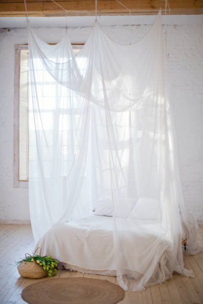 istock cozy bedroom in white colors 1125256494