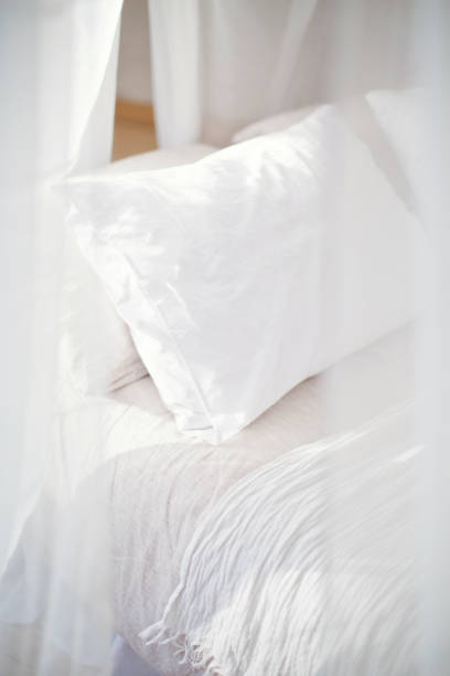 istock cozy bedroom in white colors 1125256543