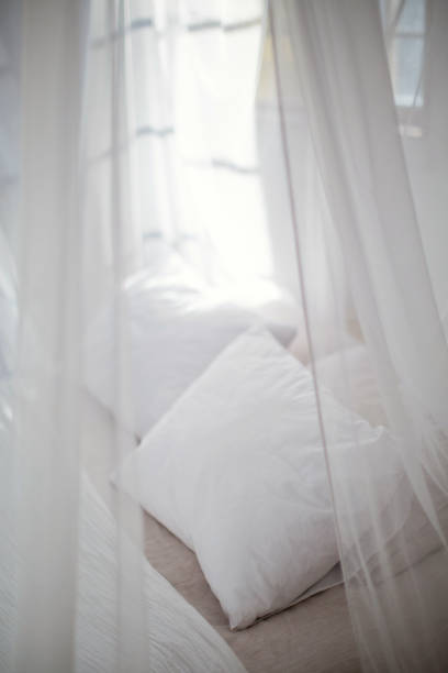 istock cozy bedroom in white colors 1125256544