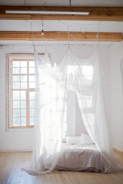 istock cozy bedroom in white colors 1125256548