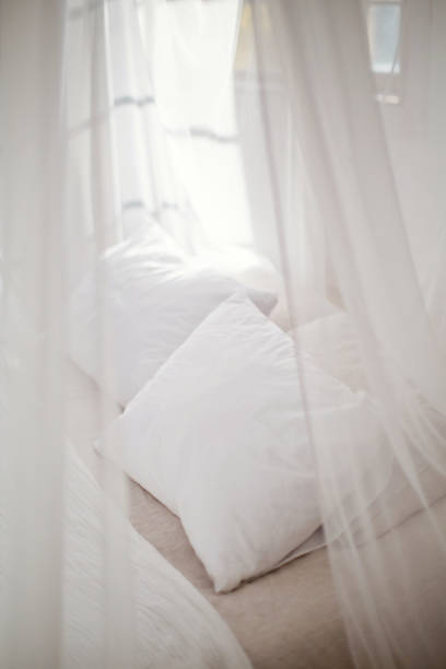 istock cozy bedroom in white colors 1125256553