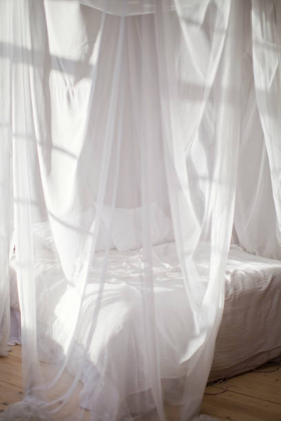 istock cozy bedroom in white colors 1125256559