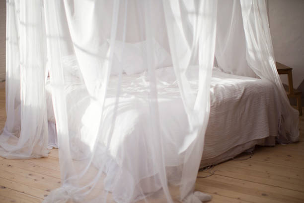 istock cozy bedroom in white colors 1125256570