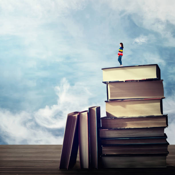 istock girl on a books pile 1125256686