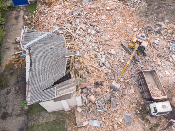 istock heavy construction machinery clearing out demolition site. aerial view 1125258413