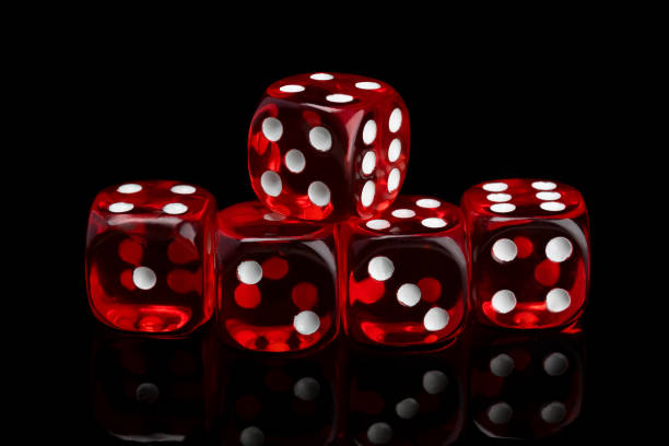 istock red transparent dice for gambling on a black background 1125259214