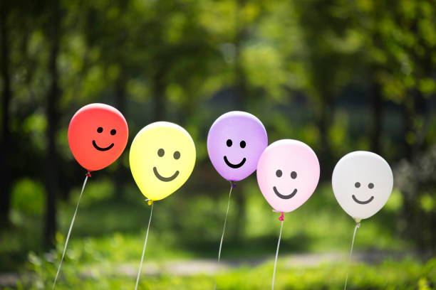 istock multicolored balloons in the forest. 1125268428