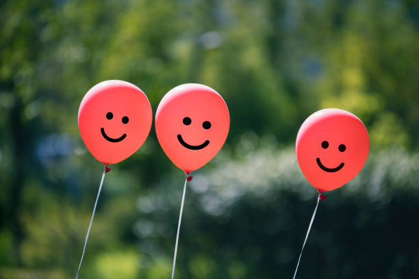 istock red colored balloons in the park. 1125268637