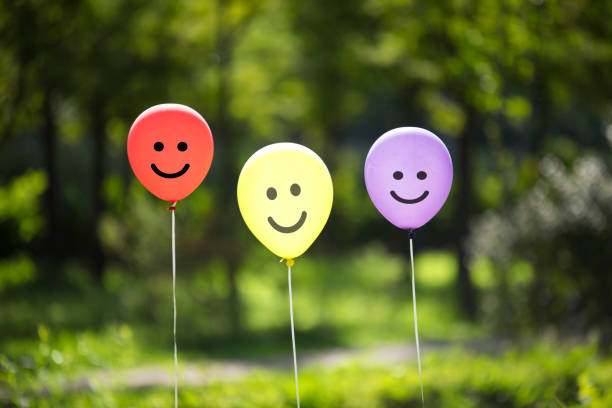 istock yellow,red and purple colored balloons background 1125268699