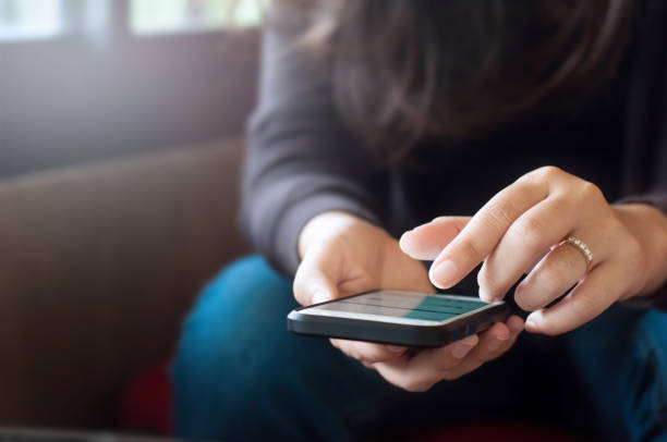 istock close up young woman using mobile smart phone at a cafe 1125271163