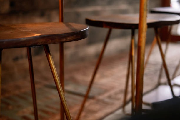 istock Rustic wood and bronze metal bar stool 1125271270
