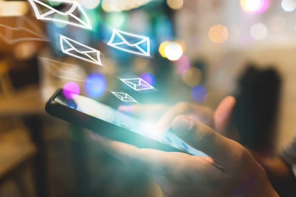 istock Woman hand using smartphone with email  icon pop up recieve and send notification on screen of mobile phone. Business communication technology concept. 1125272440