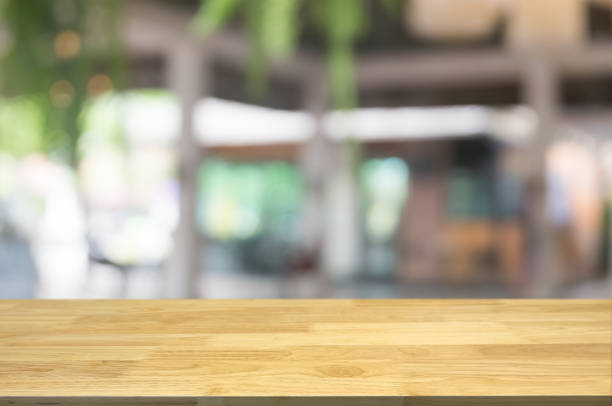 istock empty wood board in over blurred montage abstract background. 1125272722
