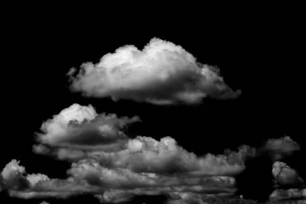 istock White fluffy clouds in the black sky background 1125273215