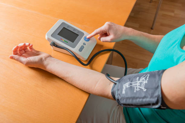 istock woman checking her blood pressure 1125283592