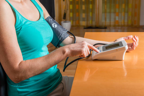 istock woman checking her blood pressure 1125283598