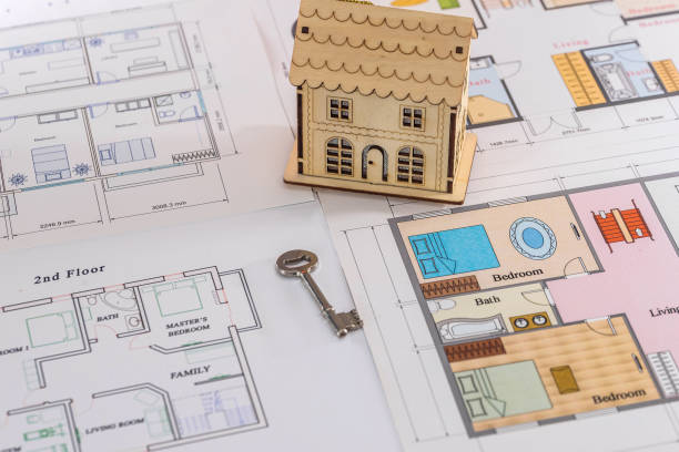 istock Wooden house on project with real key, closeup 1125283927