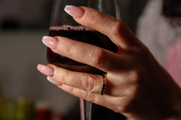 istock Woman's hands holding glass of wine 1125285834