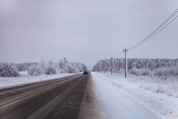 istock Country road after a snowfall in winter. 1125286490